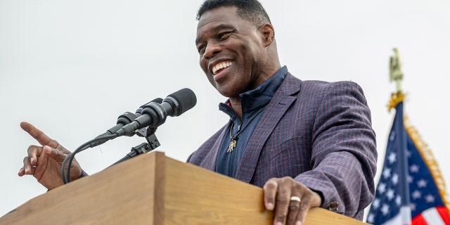 Republican US Senate candidate Herschel Walker speaks to supporters at a campaign rally on Nov. 16, 2022, in McDonough, Georgia. 