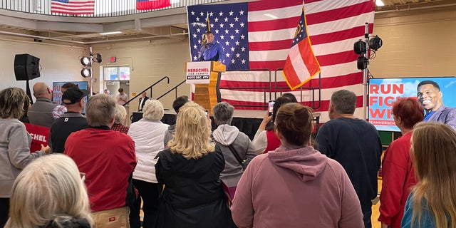 GOP Senate nominee Herschel Walker speaks to supporters at a rally in Dalton, Georgia, on Nov. 30, 2022 