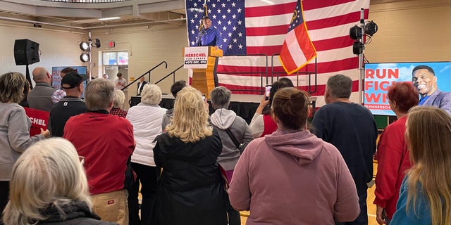 GOP Senate nominee Herschel Walker speaks to supporters at a rally in Dalton, Georgia, on Nov. 30, 2022 