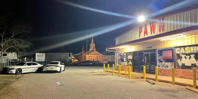 Scene outside the pawn shop where Polk County deputies were called for someone using a stolen credit card.