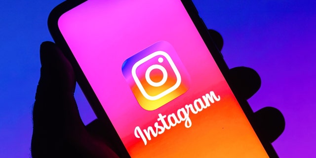 In this photo illustration the Instagram logo seen displayed on a smartphone. 