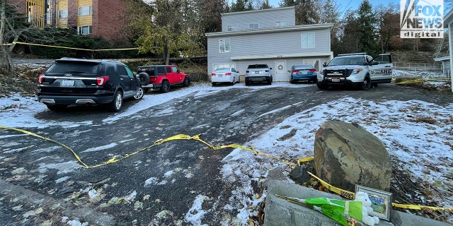 A Latah County deputy watches over the crime scene on Thanksgiving morning.