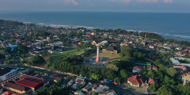 Pictured: An aerial photo showing the tsunami tower (center) overlooking the Indian Ocean in Bengkulu on May 2, 2021.