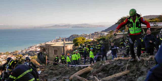 A lifeless dog is extracted from under the debris of a collapsed house in Casamicciola, on the Italian island of Ischia, on Nov. 28, 2022. Exceptionally heavy rain caused a chunk of Mount Epomeo to come crashing down before dawn on Nov. 26, 2022, gaining speed as it entered the populated port town of Casamicciola.