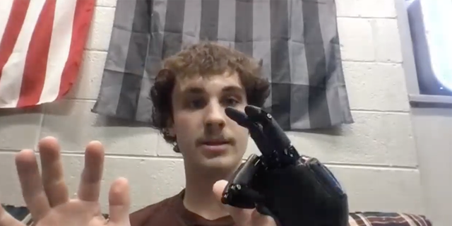 Jackson Schroeder shows the movement of his fingers during an interview with Fox News Digital on Nov. 7, 2022.