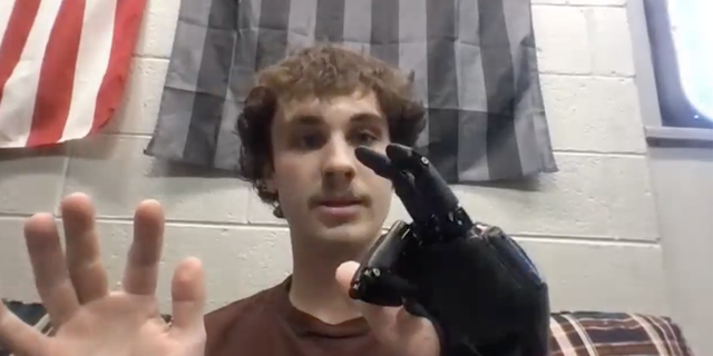 Jackson Schroeder shows the movement of his fingers during an interview with Fox News Digital on Nov. 7, 2022.