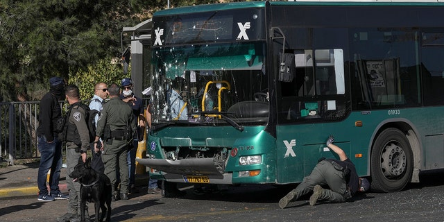 Israeli police inspect the site of an explosion at a bus stop in Jerusalem, Wednesday, November 11.  23 October 2022 Two explosions rocked bus stops in Jerusalem, killing one person and injuring at least 14 in what Israeli police say was a suspected attack by Palestinians.