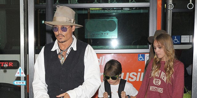 Johnny Depp, Jack Depp and Lily-Rose Depp arrive at Narita International Airport on July 16, 2013.
