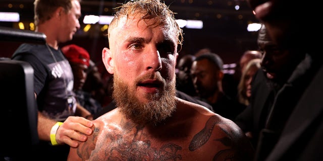 Jake Paul exits the ring after his unanimous decision win over Anderson Silva of Brazil in their cruiserweight bout at Desert Diamond Arena on October 29, 2022 in Glendale, Arizona.