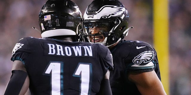 A.J. Brown, #11 of the Philadelphia Eagles, celebrates with Jalen Hurts, #1, after a 6-yard touchdown pass during the third quarter against the Green Bay Packers at Lincoln Financial Field on Nov. 27, 2022 in Philadelphia.