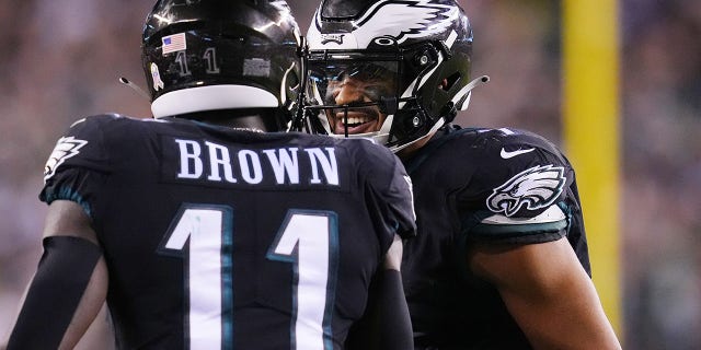 A.J. Brown #11 of the Philadelphia Eagles celebrates with Jalen Hurts #1 after a 6-yard touchdown pass during the third quarter against the Green Bay Packers at Lincoln Financial Field on November 27, 2022 in Philadelphia, Pennsylvania. 