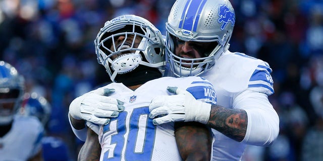 Detroit Lions running back Jamaal Williams (30) celebrates after scoring a touchdown during the first half of a game against the New York Giants on November 20, 2022 in East Rutherford, NJ 