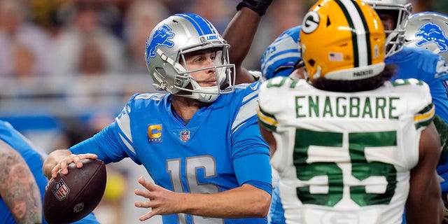 Detroit Lions quarterback Jared Goff (16) throws as Green Bay Packers linebacker Kingsley Enagbare (55) pressures during the second half, Nov. 6, 2022, in Detroit.