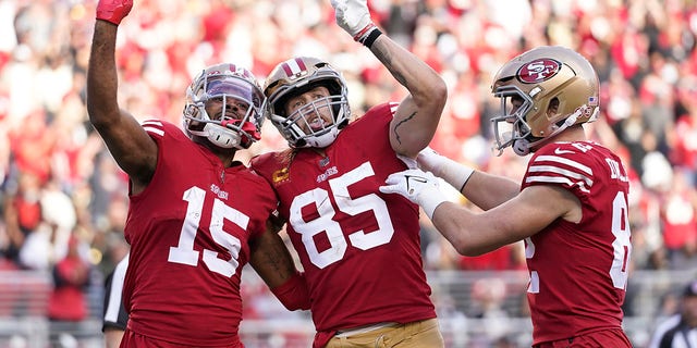 San Francisco 49ers wide receiver Jauan Jennings (15) celebrates after catching a touchdown pass with tight end George Kittle (85) and tight end Ross Dwelley during the first half against the New Orleans Saints in Santa Clara, California, Nov. 27, 2022.