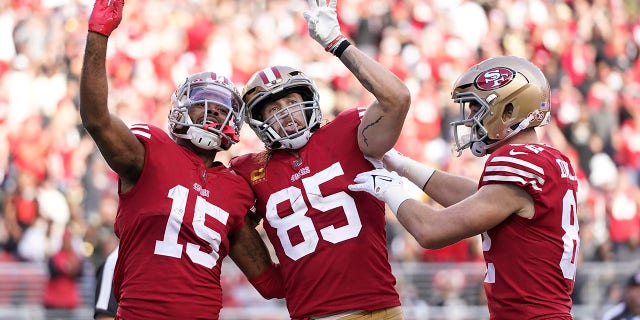 San Francisco 49ers wide receiver Jauan Jennings (15) celebrates after catching a touchdown pass with tight end George Kittle (85) and tight end Ross Dwelley during the first half against the New Orleans Saints in Santa Clara, California, Nov. 27, 2022.