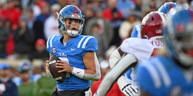 Rebels quarterback Jaxson Dart looks to pass against Alabama in Oxford, Mississippi, Saturday, Nov. 12, 2022.