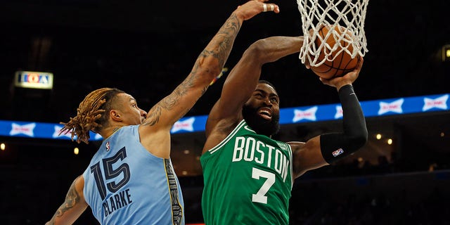 Boston Celtics guard Jaylen Brown, #7, drives to the basket as Memphis Grizzlies forward Brandon Clark, #15, defends during the second half at FedExForum in Memphis, Tennessee, Nov. 7, 2022.