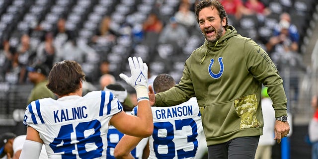 Indianapolis Colts interim head coach Jeff Saturday, right, greets tight end Nikola Kalinic before an NFL football game against the Los Vegas Raiders in Las Vegas, Sunday, Nov. 13, 2022. 