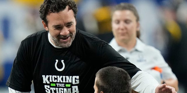 Indianapolis Colts interim head coach Jeff Saturday, left, talks with Forrest Rhyne before an NFL football game against the Pittsburgh Steelers, Monday, Nov. 28, 2022, in Indianapolis.