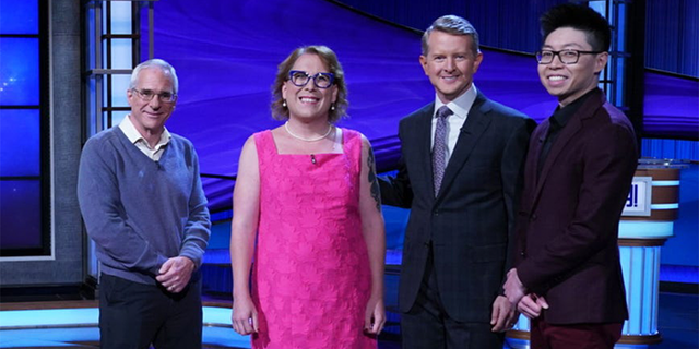 "Jeopardy!" Tournament of Champions contestants Sam Buttrey, Amy Schneider and Andrew He alongside host Ken Jennings.