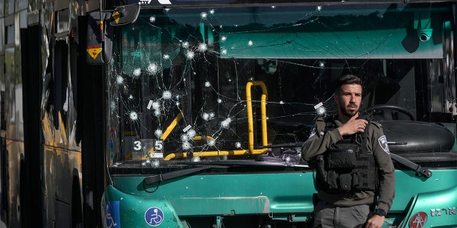 Israeli police inspect the scene of an explosion at a bus stop in Jerusalem, Wednesday, Nov. 23, 2022. 