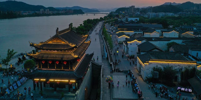 An aerial photo taken on May 2, 2021 shows the night view of Yanzhou ancient city in Meicheng Township, Jiande City of east China's Zhejiang Province. The ancient city received a total of 114,000 visitors on Saturday and Sunday.