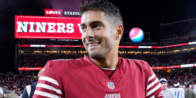 San Francisco 49ers quarterback Jimmy Garoppolo, #10, smiles after the 49ers defeated the Los Angeles Chargers in an NFL football game in Santa Clara, California, Sunday, Nov. 13, 2022. 