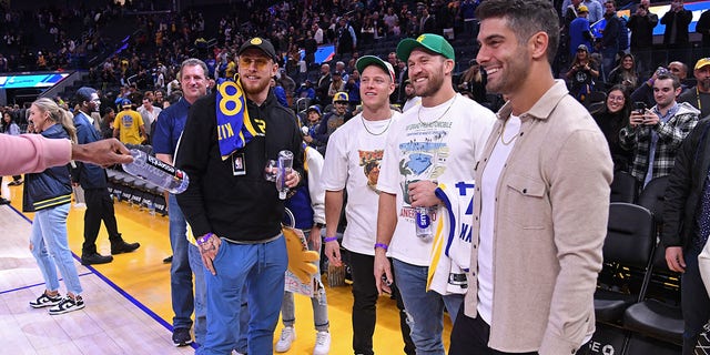 Christian McCaffrey, Jimmy Garoppolo, George Kittle and Kyle Juszczyk attend the San Antonio Spurs game against the Golden State Warriors on Nov. 14, 2022 at Chase Center in San Francisco.