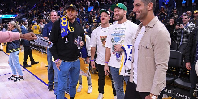 49ers Kyle Shanahan talks Jimmy Garoppolo's cheerleader interaction: 'it's a tough life he's got to live' 2 Christian McCaffrey, Jimmy Garoppolo, George Kittle and Kyle Juszczyk attend the San Antonio Spurs game against the Golden State Warriors on Nov. 14, 2022 at Chase Center in San Francisco.