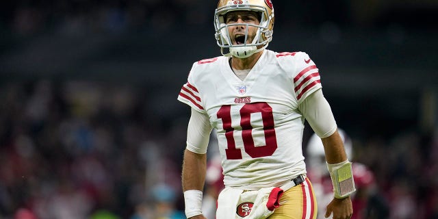 San Francisco 49ers quarterback Jimmy Garoppolo reacts after tight end George Kittle scored a touchdown during the second half of an NFL football game against the Arizona Cardinals, Monday, Nov. 21, 2022, in Mexico City.