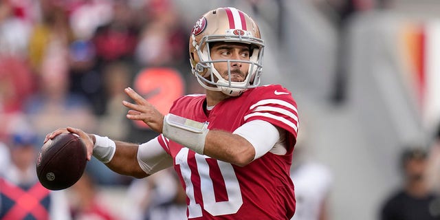 San Francisco 49ers quarterback Jimmy Garoppolo, #10, passes against the New Orleans Saints during the second half of an NFL football game on Sunday, Nov. 27, 2022, in Santa Clara, California.