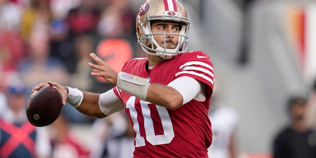 San Francisco 49ers quarterback Jimmy Garoppolo, #10, passes against the New Orleans Saints during the second half of an NFL football game on Sunday, Nov. 27, 2022, in Santa Clara, California.