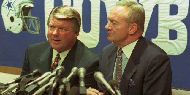 Jimmy Johnson, left, announces his resignation as head coach of the world champion Dallas Cowboys football team at a press conference at the team's Valley Ranch headquarters in Irving, Texas.