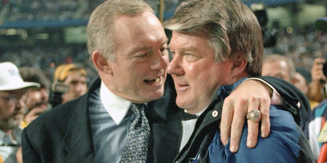 Dallas Cowboys owner Jerry Jones, left, embraces head coach Jimmy Johnson, right, as the Cowboys lead the Buffalo Bills late in the fourth quarter of Super Bowl XXVIII on January 30, 1994 at the Georgia Dome in Atlanta.