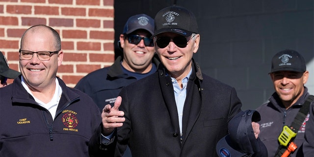 President Biden, standing next to Nantucket Fire Chief Michael Cranson, left, speaks during a Thanksgiving visit with firefighters at the Nantucket Fire Department in Nantucket, Massachusetts, on Thursday, November 24, 2022.