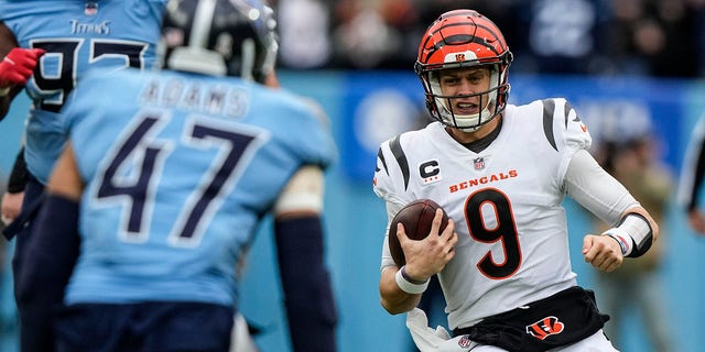 Cincinnati Bengals quarterback Joe Burrow, #9, slides after a run against the Tennessee Titans during the first half of an NFL football game, Sunday, Nov. 27, 2022, in Nashville, Tennessee.