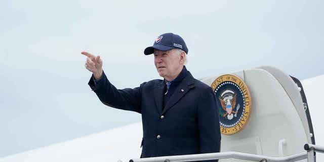 President Joe Biden gestures boarding Air Force One at Nantucket Memorial Airport in Nantucket, Mass., Sunday, Nov. 27, 2022. Biden is heading back to Washington after spending the Thanksgiving Day holiday in Nantucket with family. (AP Photo/Susan Walsh)