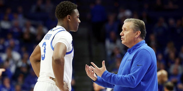 Kentucky's Adou Thiero, left, listens to coach John Calipari during the second half of the team's NCAA college basketball game against North Florida in Lexington, Kentucky on Wednesday, November 23, 2022.