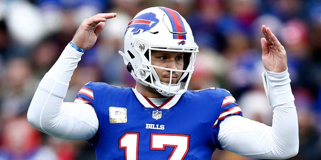 Josh Allen #17 of the Buffalo Bills signals towards the sideline during the first quarter against the Minnesota Vikings at Highmark Stadium on November 13, 2022 in Orchard Park, New York.