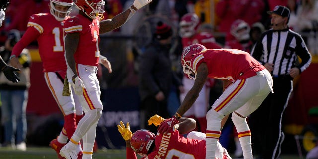 Chiefs wide receiver JuJu Smith-Schuster is checked on by teammates after being hit hard by Jacksonville Jaguars safety Andre Cisco, Sunday, Nov. 13, 2022, in Kansas City.
