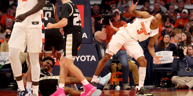 Judah Mintz of the Syracuse Orange reacts after being shoved by Doug Edert of the Bryant University Bulldogs at JMA Wireless Dome on Nov. 26, 2022, in Syracuse, New York.