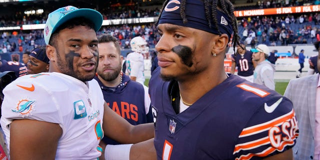 Miami Dolphins quarterback Tua Tagovailoa, left, and Chicago Bears quarterback Justin Fields congratulate each other after the Dolphins beat the Bears, 35-32, Nov. 6, 2022, in Chicago.