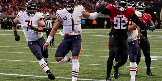 Chicago Bears quarterback Justin Fields (1) runs into the end zone for a score against the Atlanta Falcons during the first half of an NFL football game, Sunday, Nov. 20, 2022, in Atlanta. 