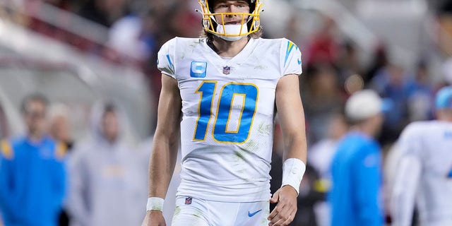 Los Angeles Chargers quarterback Justin Herbert, #10, walks on the field during the second half of an NFL football game against the San Francisco 49ers in Santa Clara, California, Sunday, Nov. 13, 2022. 