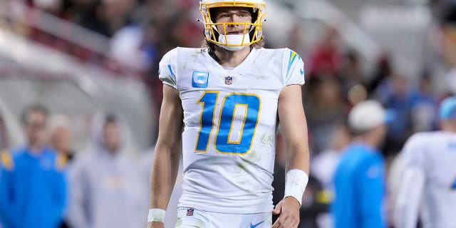 Los Angeles Chargers quarterback Justin Herbert, #10, walks on the field during the second half of an NFL football game against the San Francisco 49ers in Santa Clara, California, Sunday, Nov. 13, 2022. 