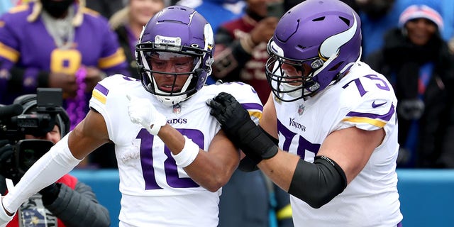 Justin Jefferson, #18 of the Minnesota Vikings, celebrates with Brian O'Neill, #75 of the Minnesota Vikings, after Jefferson's touchdown during the first quarter against the Buffalo Bills at Highmark Stadium on Nov. 13, 2022 in Orchard Park, New York.