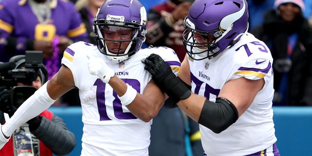 Justin Jefferson, #18 of the Minnesota Vikings, celebrates with Brian O'Neill, #75 of the Minnesota Vikings, after Jefferson's touchdown during the first quarter against the Buffalo Bills at Highmark Stadium on Nov. 13, 2022 in Orchard Park, New York.