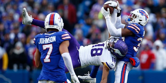 Justin Jefferson, #18 of the Minnesota Vikings, catches a pass in front of Cam Lewis, #39 of the Buffalo Bills, during the fourth quarter at Highmark Stadium on Nov. 13, 2022 in Orchard Park, New York.