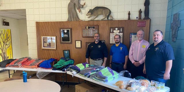 Knights of Columbus in Scranton hand out coats at the local Catholic charity, St. Francis of Assisi Kitchen.