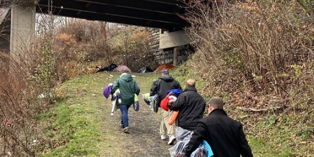 The Scranton council of the Knights of Columbus walks public trails handing out coats to homeless youth